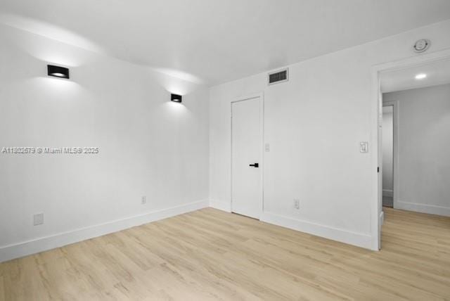 14840 Naranja Lakes Blvd Unit C4B, Homestead, FL 33032 - empty room with light wood finished floors, baseboards, and a smoke detector