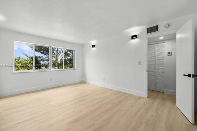 14840 Naranja Lakes Blvd Unit C4B, Homestead, FL 33032 - empty room with light wood-style floors and baseboards