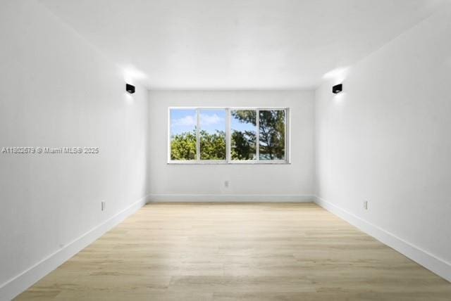 14840 Naranja Lakes Blvd Unit C4B, Homestead, FL 33032 - unfurnished room with baseboards and light wood-type flooring