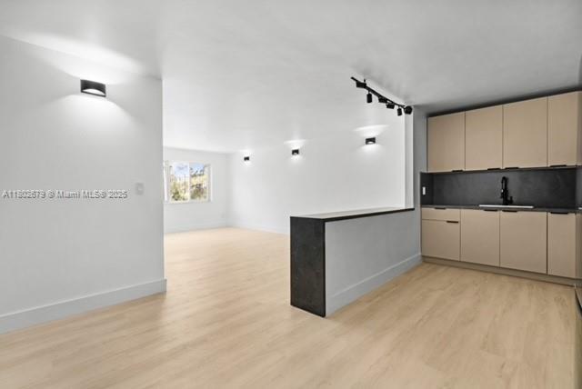 14840 Naranja Lakes Blvd Unit C4B, Homestead, FL 33032 - kitchen featuring cream cabinets, a sink, light wood-style floors, open floor plan, and baseboards