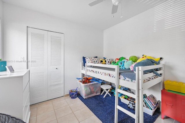241 W Park Dr Unit 5-103, Miami, FL 33172 - bedroom with light tile patterned floors, ceiling fan, and a closet