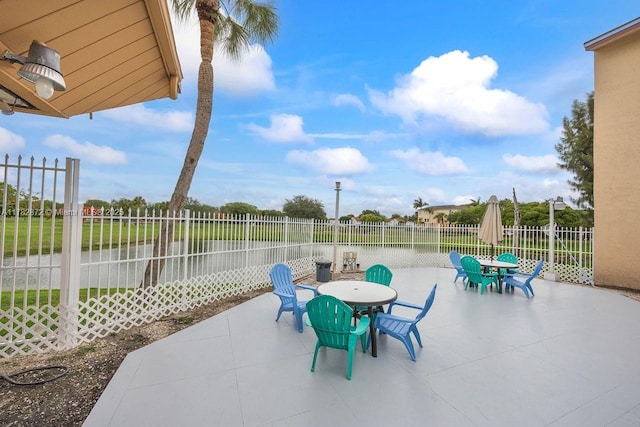 241 W Park Dr Unit 5-103, Miami, FL 33172 - view of patio / terrace with outdoor dining area and a fenced backyard
