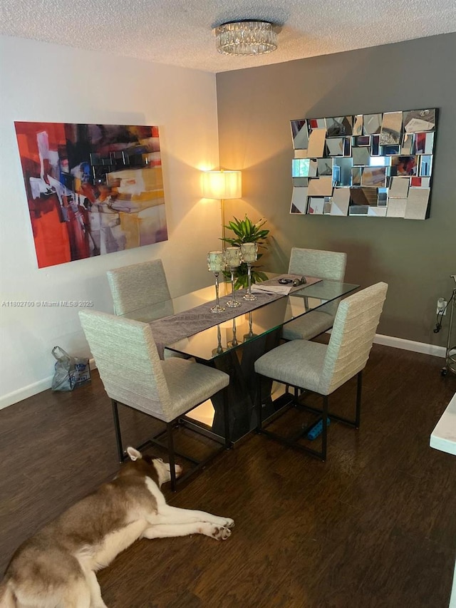 1610 NW 128th Dr Unit 104, Sunrise, FL 33323 - dining room with a textured ceiling, wood finished floors, and baseboards