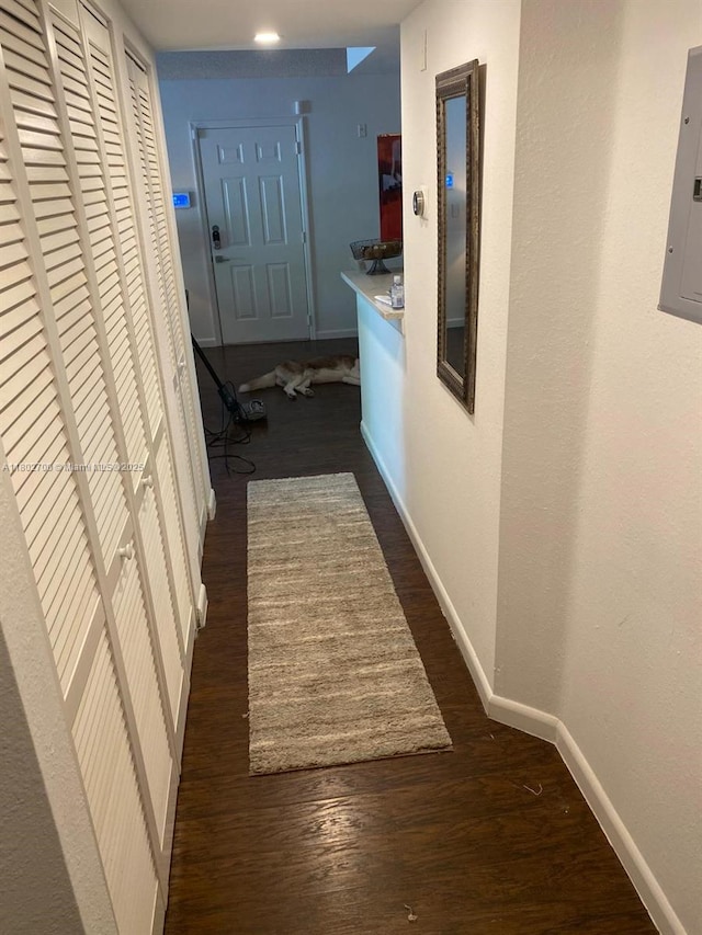 1610 NW 128th Dr Unit 104, Sunrise, FL 33323 - hall featuring wood finished floors, baseboards, and electric panel