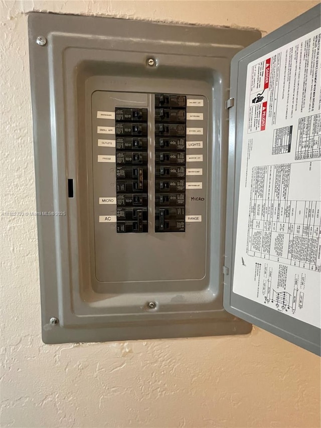 utility room featuring electric panel