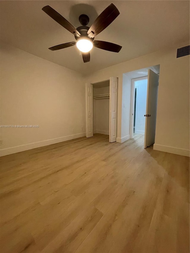 unfurnished bedroom featuring baseboards and light wood finished floors
