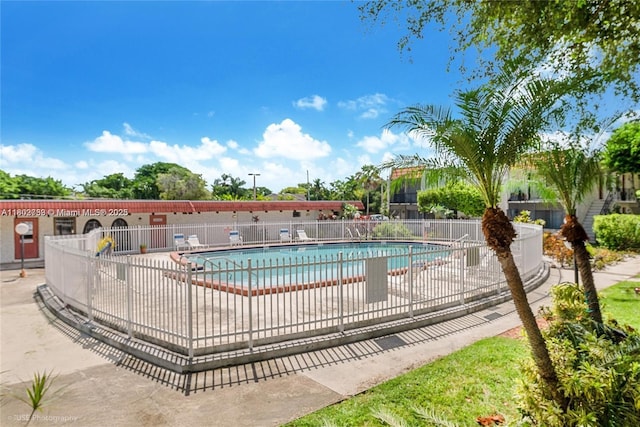 community pool featuring fence