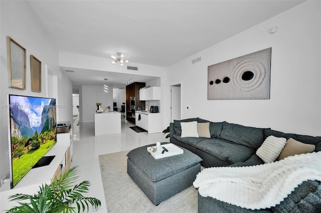 851 NE 1st Ave Unit 3107, Miami, FL 33132 - living room with light tile patterned floors and a chandelier