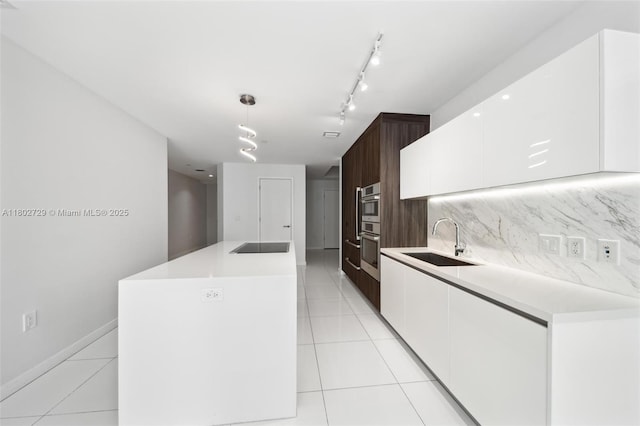 kitchen with a sink, white cabinetry, modern cabinets, and light tile patterned floors