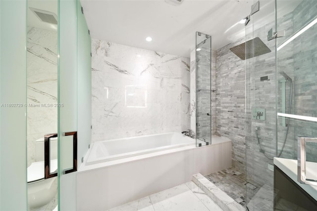 851 NE 1st Ave Unit 3107, Miami, FL 33132 - full bathroom with a garden tub, a stall shower, tile walls, vanity, and marble finish flooring