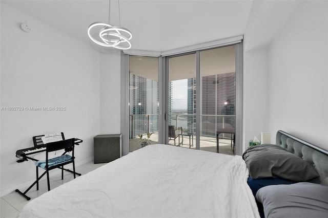 851 NE 1st Ave Unit 3107, Miami, FL 33132 - bedroom with access to outside, a wall of windows, a chandelier, and light tile patterned floors
