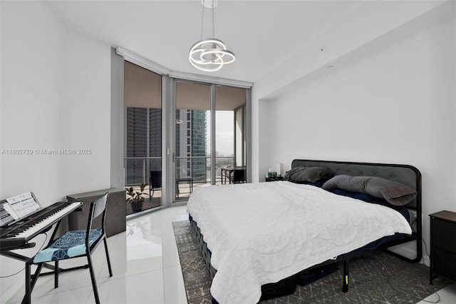 851 NE 1st Ave Unit 3107, Miami, FL 33132 - bedroom featuring floor to ceiling windows, access to outside, tile patterned floors, and a chandelier