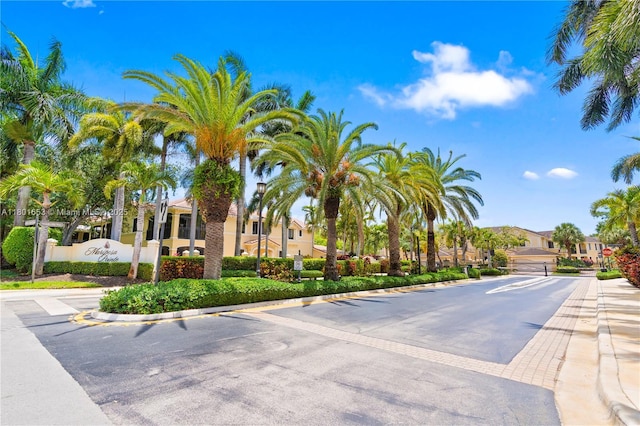 1504 Passion Vine Cir Unit 23-4, Weston, FL 33326 - view of asphalt street featuring a residential view, curbs, and street lighting