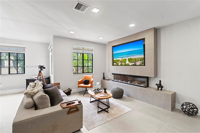 1504 Passion Vine Cir Unit 23-4, Weston, FL 33326 - living area with healthy amount of natural light, a premium fireplace, baseboards, and recessed lighting