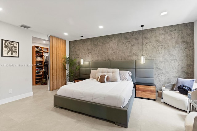 1504 Passion Vine Cir Unit 23-4, Weston, FL 33326 - bedroom featuring a walk in closet, recessed lighting, an accent wall, and a closet