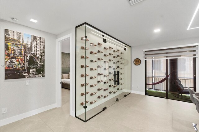 1504 Passion Vine Cir Unit 23-4, Weston, FL 33326 - wine cellar featuring baseboards and tile patterned floors