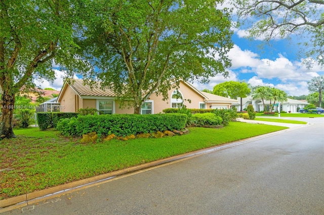 1708 NW 126th Dr, Coral Springs, FL 33071 - view of front facade featuring a garage, stucco siding, driveway, and a front yard