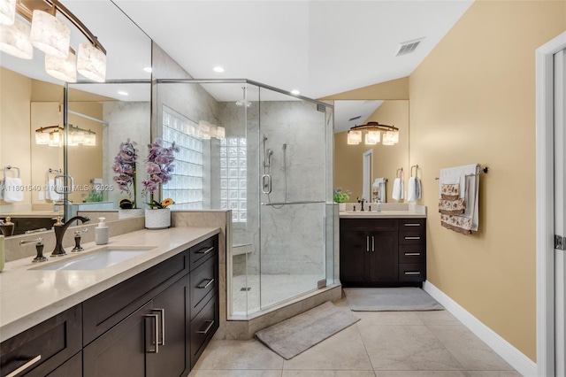 1708 NW 126th Dr, Coral Springs, FL 33071 - bathroom with a shower stall, two vanities, baseboards, tile patterned floors, and recessed lighting
