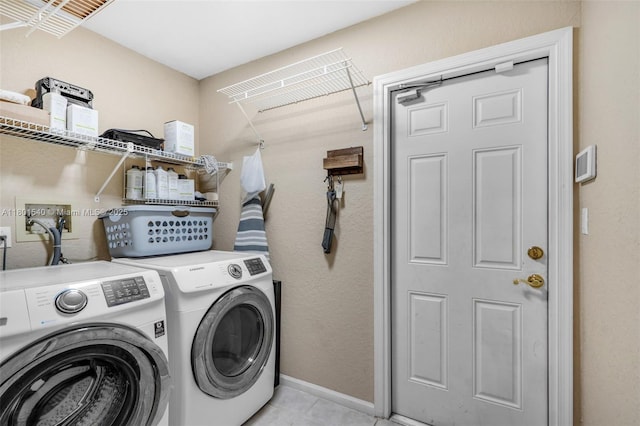 1708 NW 126th Dr, Coral Springs, FL 33071 - washroom featuring washing machine and dryer, light tile patterned floors, and baseboards