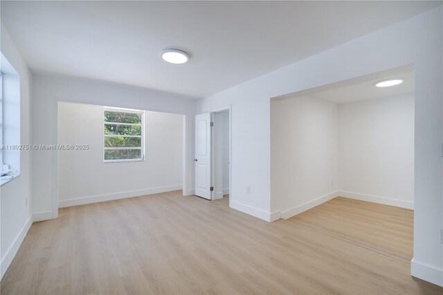 6830 SW 1st St, Miami, FL 33144 - empty room with wood finished floors and baseboards