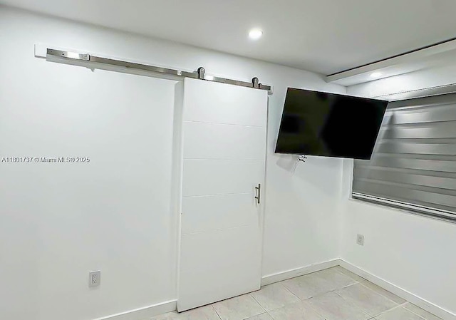 6355 SW 138th Path Unit 6355, Miami, FL 33183 - below grade area with a barn door, baseboards, light tile patterned floors, and recessed lighting