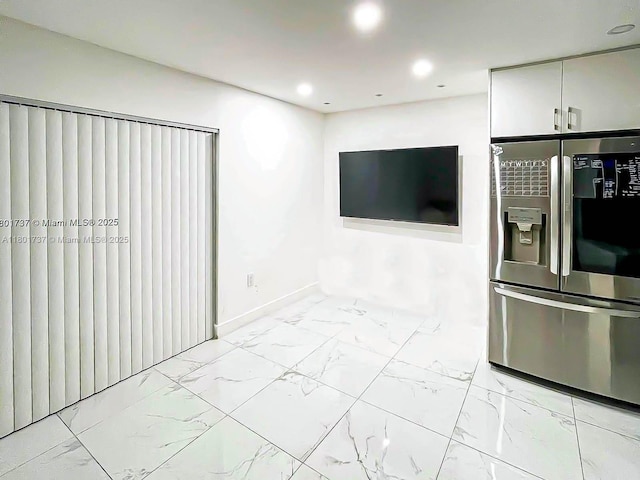 6355 SW 138th Path Unit 6355, Miami, FL 33183 - unfurnished living room featuring marble finish flooring, baseboards, and recessed lighting