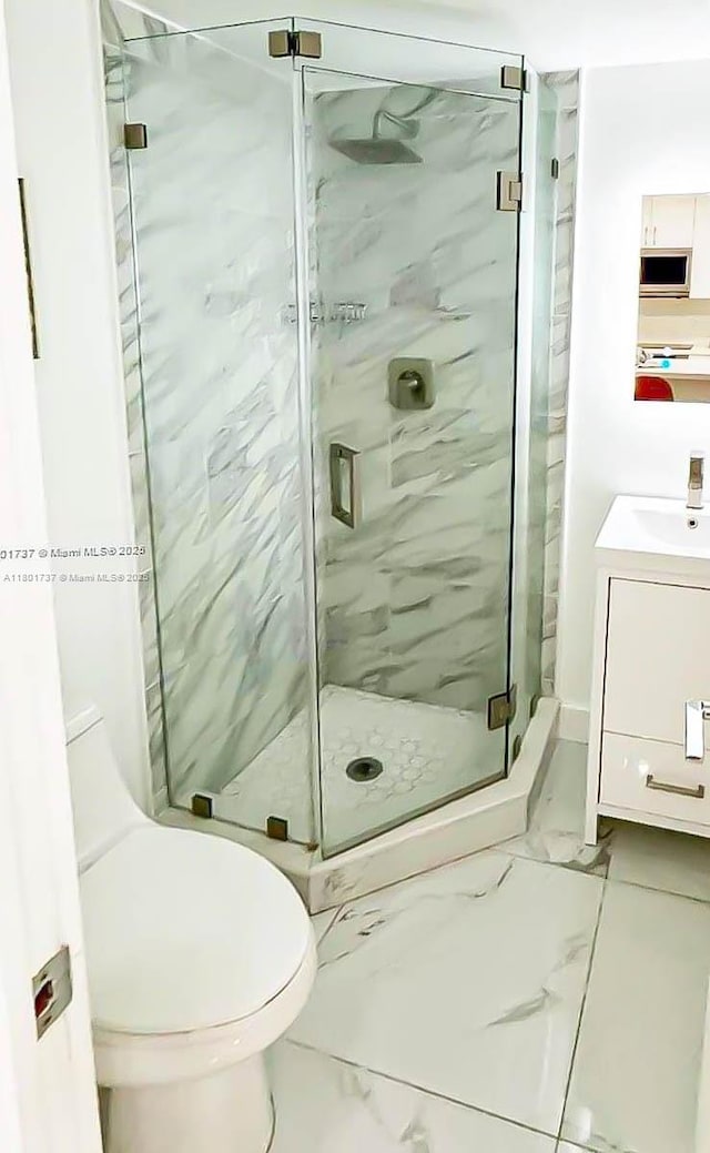 6355 SW 138th Path Unit 6355, Miami, FL 33183 - bathroom featuring marble finish floors, a marble finish shower, vanity, and toilet
