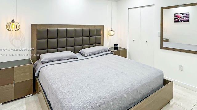 6355 SW 138th Path Unit 6355, Miami, FL 33183 - tiled bedroom featuring a closet and baseboards