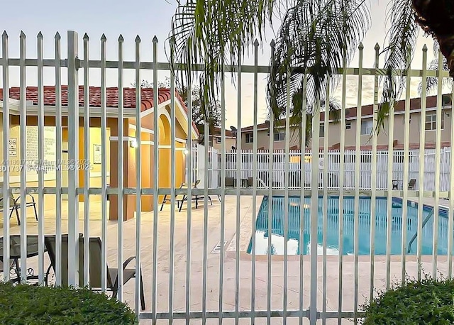6355 SW 138th Path Unit 6355, Miami, FL 33183 - gate featuring fence and a community pool
