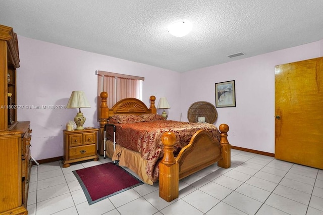 330 SW 133rd Ct, Miami, FL 33184 - bedroom with a textured ceiling, light tile patterned floors, and baseboards