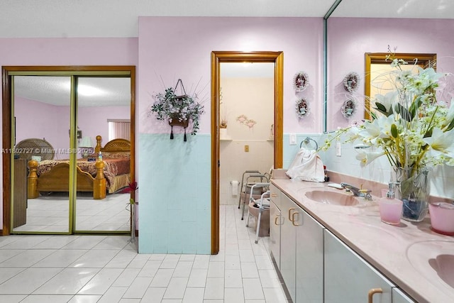 330 SW 133rd Ct, Miami, FL 33184 - ensuite bathroom featuring double vanity and tile patterned floors