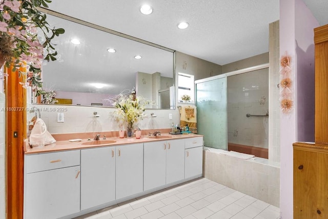 330 SW 133rd Ct, Miami, FL 33184 - full bath featuring a tile shower, tile patterned floors, double vanity, recessed lighting, and a textured ceiling