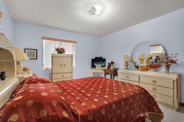330 SW 133rd Ct, Miami, FL 33184 - tiled bedroom featuring a textured ceiling