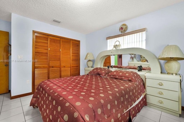 330 SW 133rd Ct, Miami, FL 33184 - tiled bedroom with a closet and a textured ceiling