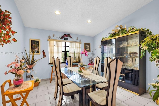 330 SW 133rd Ct, Miami, FL 33184 - dining room with a textured ceiling, recessed lighting, light tile patterned floors, baseboards, and lofted ceiling