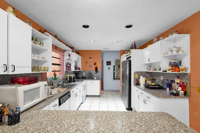 330 SW 133rd Ct, Miami, FL 33184 - kitchen with open shelves, white appliances, white cabinetry, a textured ceiling, and light tile patterned floors