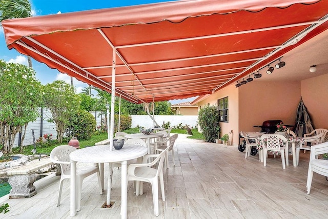 330 SW 133rd Ct, Miami, FL 33184 - view of patio with outdoor dining space and a fenced backyard