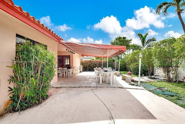 330 SW 133rd Ct, Miami, FL 33184 - view of patio with outdoor dining space and fence
