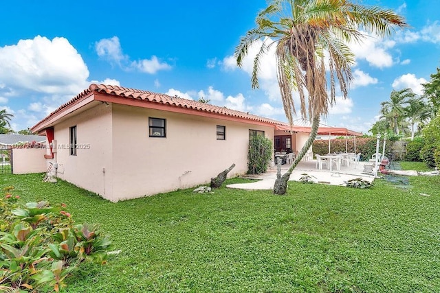 330 SW 133rd Ct, Miami, FL 33184 - rear view of house featuring stucco siding, a tile roof, and a patio area