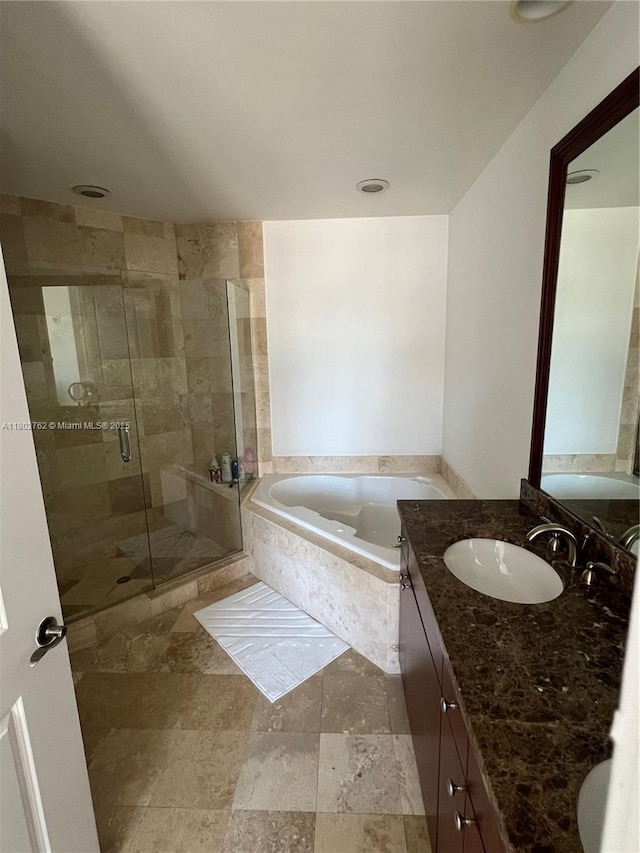 1607 Ponce De Leon Blvd Unit 8B, Coral Gables, FL 33134 - full bathroom featuring a bath, vanity, a shower stall, and stone finish floors
