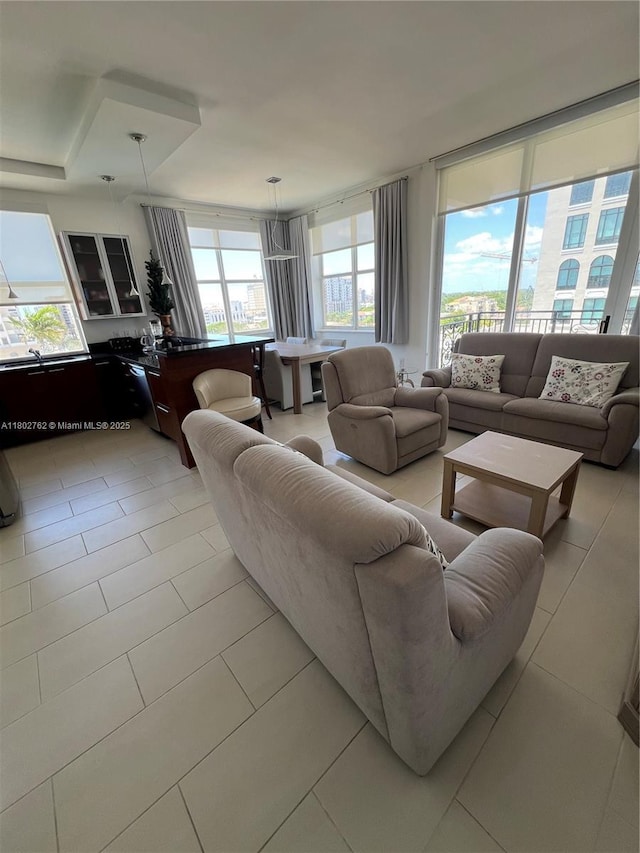 1607 Ponce De Leon Blvd Unit 8B, Coral Gables, FL 33134 - living area featuring plenty of natural light and light tile patterned floors