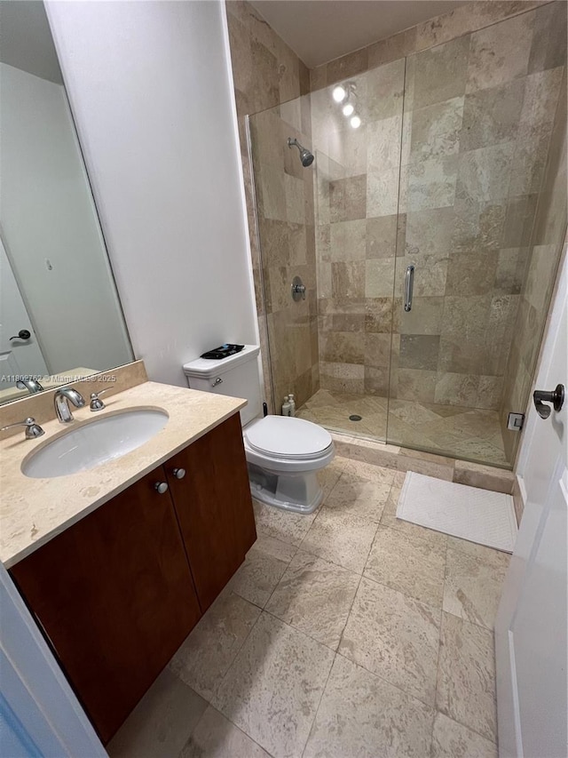 1607 Ponce De Leon Blvd Unit 8B, Coral Gables, FL 33134 - full bathroom with toilet, a stall shower, and vanity
