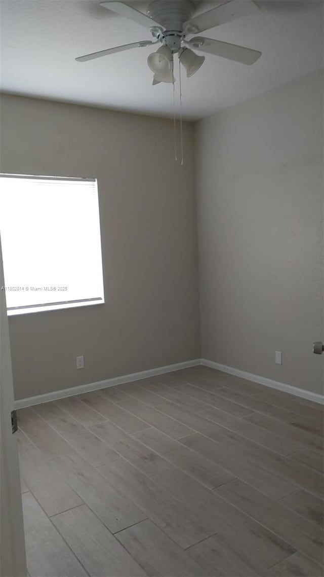 1165 Golden Lakes Blvd Unit 1221, West Palm Beach, FL 33411 - spare room with ceiling fan and wood finished floors