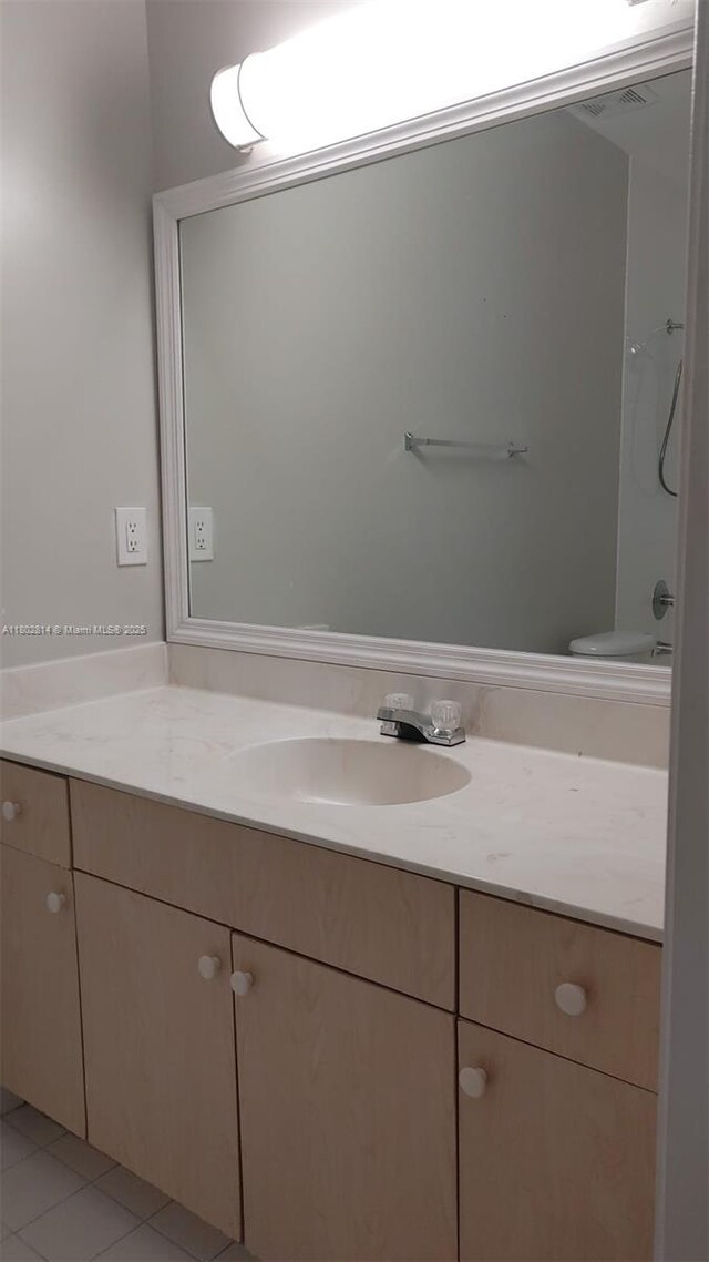 1165 Golden Lakes Blvd Unit 1221, West Palm Beach, FL 33411 - full bathroom featuring vanity and tile patterned flooring