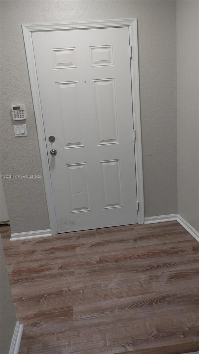 1165 Golden Lakes Blvd Unit 1221, West Palm Beach, FL 33411 - foyer with wood finished floors and a textured wall