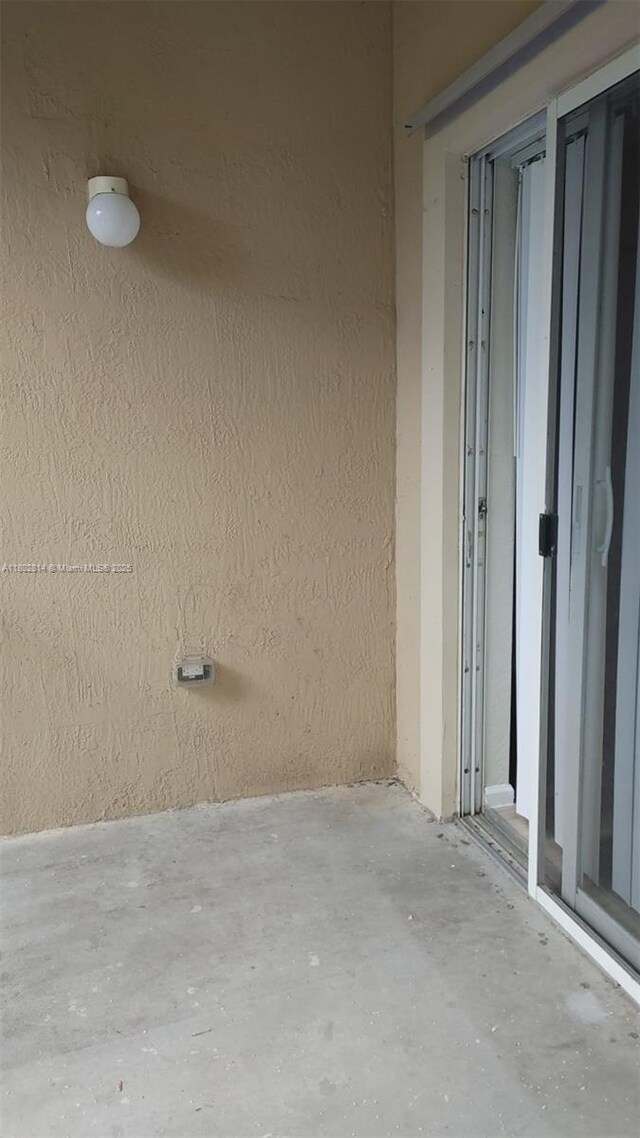 1165 Golden Lakes Blvd Unit 1221, West Palm Beach, FL 33411 - empty room with wood finished floors and baseboards