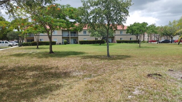 1165 Golden Lakes Blvd Unit 1221, West Palm Beach, FL 33411 - view of green lawn