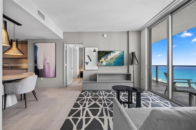 4010 S Ocean Dr Unit T3607, Hollywood, FL 33019 - living area with floor to ceiling windows, light wood-style flooring, and baseboards