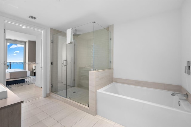 4010 S Ocean Dr Unit T3607, Hollywood, FL 33019 - bathroom featuring a stall shower, ensuite bathroom, a bath, and tile patterned flooring