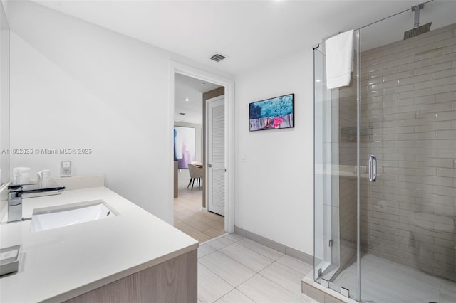 4010 S Ocean Dr Unit T3607, Hollywood, FL 33019 - full bathroom featuring a shower stall, tile patterned floors, vanity, and baseboards